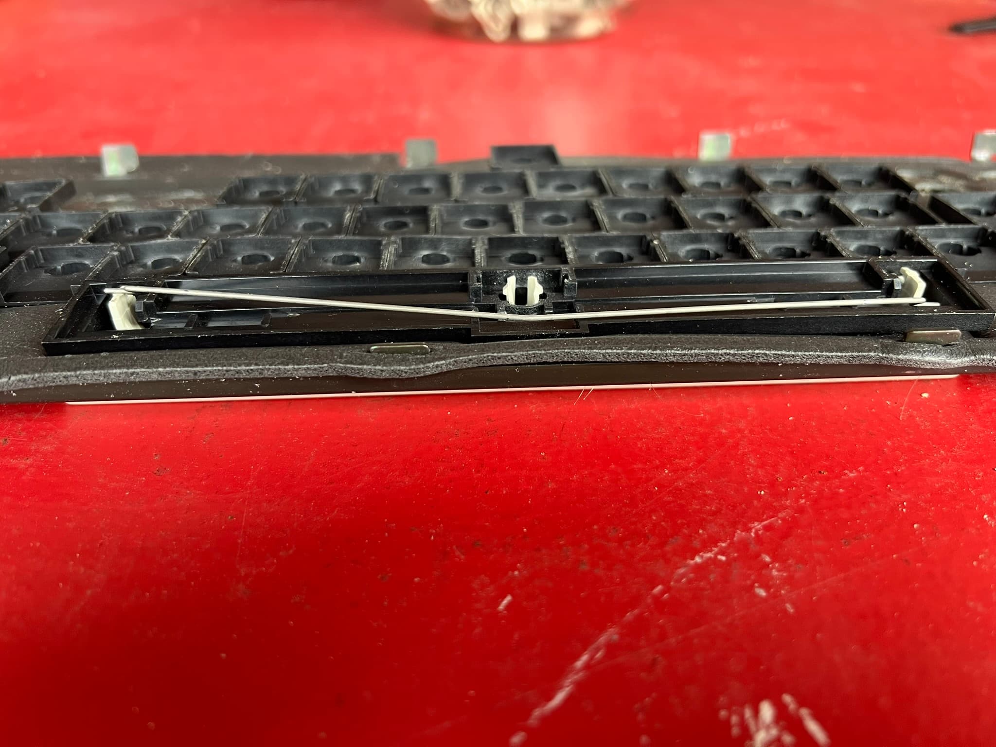 Non-removable spacebar wire